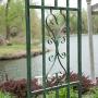 Steel Outdoor Garden Arbor (7-ft.) in Powder Coated Black Verdigris Finish with Intricate Scrollwork Design - Ideal for Climbing Vines and Plants Steel Outdoor Garden Arbor (7-ft.) in Powder Coated Black Verdigris Finish with Intricate Scrollwork Design - Ideal for Climbing Vines and Plants